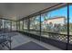 View from the screened-in porch showcasing the home's landscaping at 4403 5Th W Ave, Palmetto, FL 34221