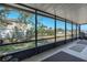 View from the screened-in porch showcasing the home's landscaping at 4403 5Th W Ave, Palmetto, FL 34221