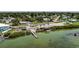 Beautiful view showcases a waterfront community with dock, boat ramp, and lush green surroundings at 4403 5Th W Ave, Palmetto, FL 34221