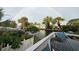 Enjoy a lovely outdoor space overlooking the canal, featuring tropical landscaping and delightful rainbow views on a rainy day at 501 Key Royale Dr, Holmes Beach, FL 34217