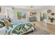 Bright bedroom featuring sliding glass doors to balcony, mirrored closet doors, and neutral decor at 501 Key Royale Dr, Holmes Beach, FL 34217
