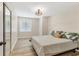 Neutral bedroom features hardwood floors, a window for natural light, and closet at 501 Key Royale Dr, Holmes Beach, FL 34217