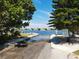 Scenic boat ramp surrounded by trees, allowing access to the beautiful, shimmering waterway at 501 Key Royale Dr, Holmes Beach, FL 34217