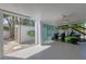 Spacious garage with a golf cart and storage shed, providing ample space for vehicles and equipment at 501 Key Royale Dr, Holmes Beach, FL 34217