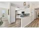 Bright kitchen featuring white cabinets, modern appliances, and a stylish breakfast bar at 501 Key Royale Dr, Holmes Beach, FL 34217