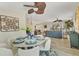 Cozy living area featuring a dining area, comfortable sofa, and tasteful decorations at 501 Key Royale Dr, Holmes Beach, FL 34217