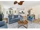 Open concept living room with barstool seating at the kitchen counter at 501 Key Royale Dr, Holmes Beach, FL 34217