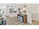 Open-concept living space with modern light fixtures, breakfast bar, and elegant furnishings at 501 Key Royale Dr, Holmes Beach, FL 34217