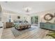 Spacious main bedroom with a king bed and sliding glass doors to the deck at 501 Key Royale Dr, Holmes Beach, FL 34217