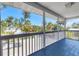 Inviting screened porch offering serene views of lush tropical landscaping at 501 Key Royale Dr, Holmes Beach, FL 34217
