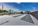 Outdoor shuffleboard courts feature clear markings, offering a recreational amenity under a bright blue sky at 501 Key Royale Dr, Holmes Beach, FL 34217