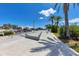 Outdoor community skate park features smooth concrete surfaces and metal rails for recreation under a clear blue sky at 501 Key Royale Dr, Holmes Beach, FL 34217