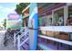 Beach rental and gift shop with surfboards and bike rentals on a sunny day at 501 Key Royale Dr, Holmes Beach, FL 34217