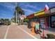 French restaurant with sidewalk seating and menu board displayed along brick pathway at 501 Key Royale Dr, Holmes Beach, FL 34217