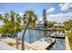 Waterfront home featuring a private dock and outdoor seating for enjoying water views at 501 Key Royale Dr, Holmes Beach, FL 34217