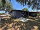 Exterior rear view of home with screened in patio at 5030 Lahaina Dr, Sarasota, FL 34232