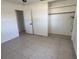 Bedroom with tile flooring, closet and neutral paint at 5030 Lahaina Dr, Sarasota, FL 34232