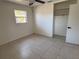 Bedroom with tile floors, closet and ceiling fan at 5030 Lahaina Dr, Sarasota, FL 34232