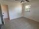 Bedroom featuring neutral paint, tile floor and natural light at 5030 Lahaina Dr, Sarasota, FL 34232