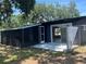 Rear view showing screen lanai and fenced yard at 5030 Lahaina Dr, Sarasota, FL 34232