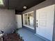 Inviting front entrance with a decorative white door, a large window, and a well-maintained landscaped area at 5030 Lahaina Dr, Sarasota, FL 34232