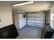 Spacious garage with an overhead door and ample storage for vehicles and other belongings at 5030 Lahaina Dr, Sarasota, FL 34232