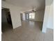 Bright living room featuring tile floors and an entry door that allows natural light at 5030 Lahaina Dr, Sarasota, FL 34232