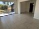Open living area with sliding glass doors that lead to a screened lanai and the backyard at 5030 Lahaina Dr, Sarasota, FL 34232