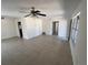 Bright living room featuring tile floors, a ceiling fan, and neutral walls at 5030 Lahaina Dr, Sarasota, FL 34232
