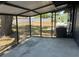 Enclosed patio overlooking fenced backyard at 5030 Lahaina Dr, Sarasota, FL 34232