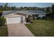 Charming single-story home featuring a well-maintained lawn, and a two car garage at 512 Shamrock Blvd, Venice, FL 34293