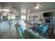 Open concept living space with ceiling fan, adjacent dining and kitchen areas at 512 Shamrock Blvd, Venice, FL 34293