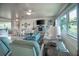 Bright living room with ceiling fan, furniture and adjacent dining and kitchen areas at 512 Shamrock Blvd, Venice, FL 34293