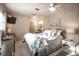 Cozy main bedroom with comfortable bed, dresser, and ensuite bathroom access at 512 Shamrock Blvd, Venice, FL 34293