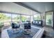 Relaxing sunroom with comfortable seating and bright views of the outdoors at 512 Shamrock Blvd, Venice, FL 34293