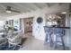 Sunroom with barstool seating and view of the adjacent kitchen at 512 Shamrock Blvd, Venice, FL 34293