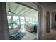 Bright sunroom with a dining table, large windows, and sliding doors to the outside at 512 Shamrock Blvd, Venice, FL 34293