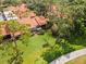 Aerial view of a villa community featuring well-maintained lawns, mature trees, and a charming neighborhood at 5336 Huntingwood Ct # 24, Sarasota, FL 34235