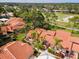 Beautiful aerial view of the neighborhood, golf course and landscaping at 5336 Huntingwood Ct # 24, Sarasota, FL 34235