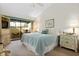 Bedroom with large window and access to a private patio at 5336 Huntingwood Ct # 24, Sarasota, FL 34235