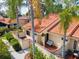 Charming villa with a private courtyard entrance, lush landscaping, and a welcoming atmosphere at 5336 Huntingwood Ct # 24, Sarasota, FL 34235