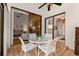 Covered lanai with a glass table and chairs for outdoor seating and dining at 5336 Huntingwood Ct # 24, Sarasota, FL 34235