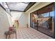Patio with access to bedroom with sliding glass doors at 5336 Huntingwood Ct # 24, Sarasota, FL 34235