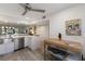 Bright kitchen featuring stainless steel sink with stainless steel mobile kitchen island at 536 Lakeside Dr # 0, Bradenton, FL 34210