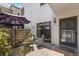 Enclosed patio with outdoor seating, privacy fence, and sunny ambiance at 536 Lakeside Dr # 536, Bradenton, FL 34210