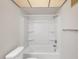 Bright bathroom features a shower-tub combo with built-in shelving at 5800 Hollywood Blvd # 312, Sarasota, FL 34231