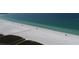 An aerial view of the soft white sand of Siesta Key Beach and bright blue-green waters at 5800 Hollywood Blvd # 312, Sarasota, FL 34231