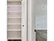 Bedroom closet features custom shelving, offering ample storage space at 5800 Hollywood Blvd # 312, Sarasota, FL 34231