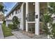 Building exterior with a charming fountain, wrought iron railing, and well-maintained landscaping at 5800 Hollywood Blvd # 312, Sarasota, FL 34231