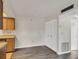 Eat-in kitchen with gray flooring, wooden cabinets, and a large closet at 5800 Hollywood Blvd # 312, Sarasota, FL 34231